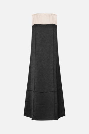 Front view of a long sleeveless dress with a pale ivory upper panel, black crinkled-texture skirt, and square neckline