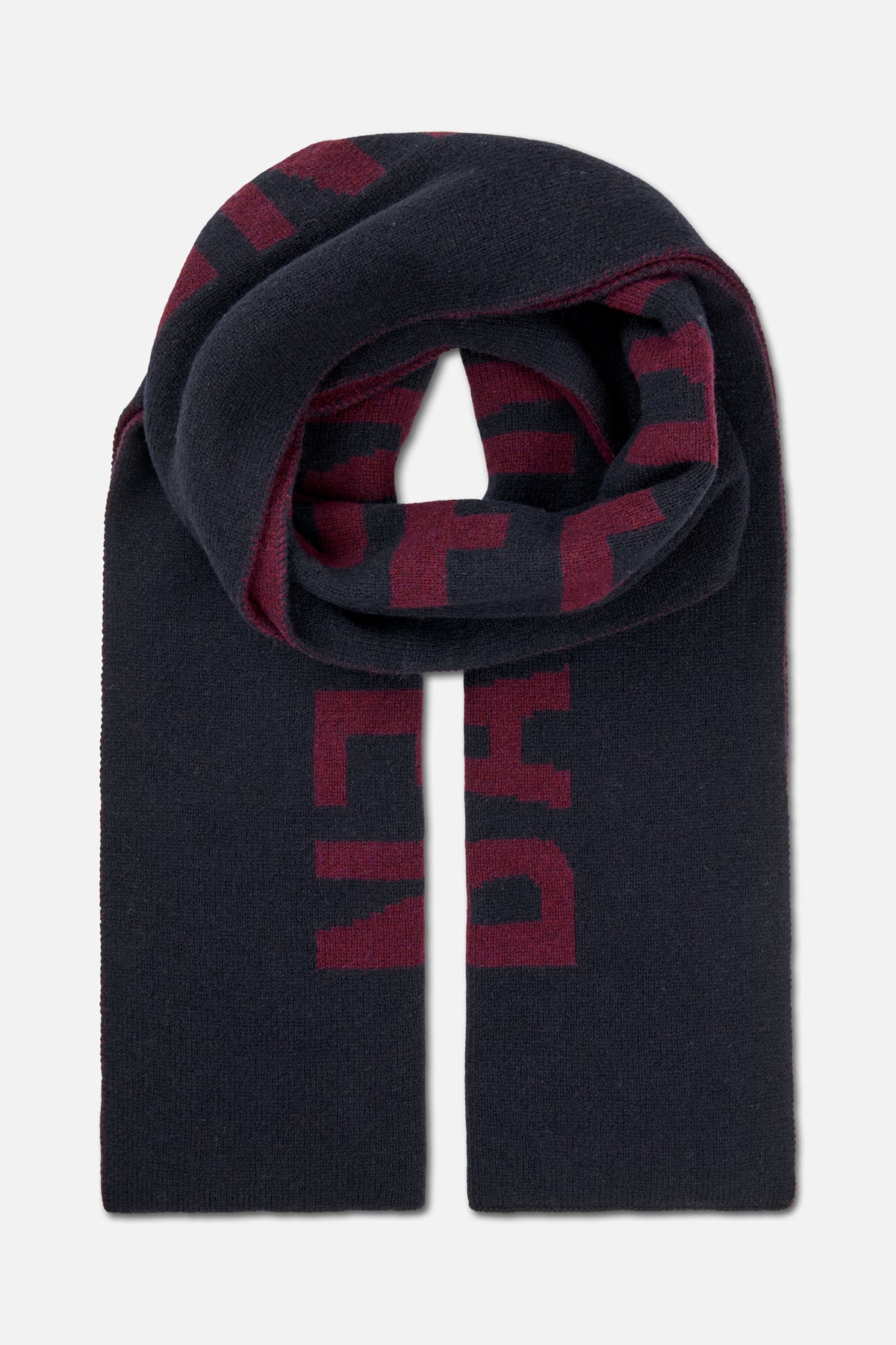 Long dark navy knitted scarf with burgundy geometric lettering, folded and draped to show its pattern.