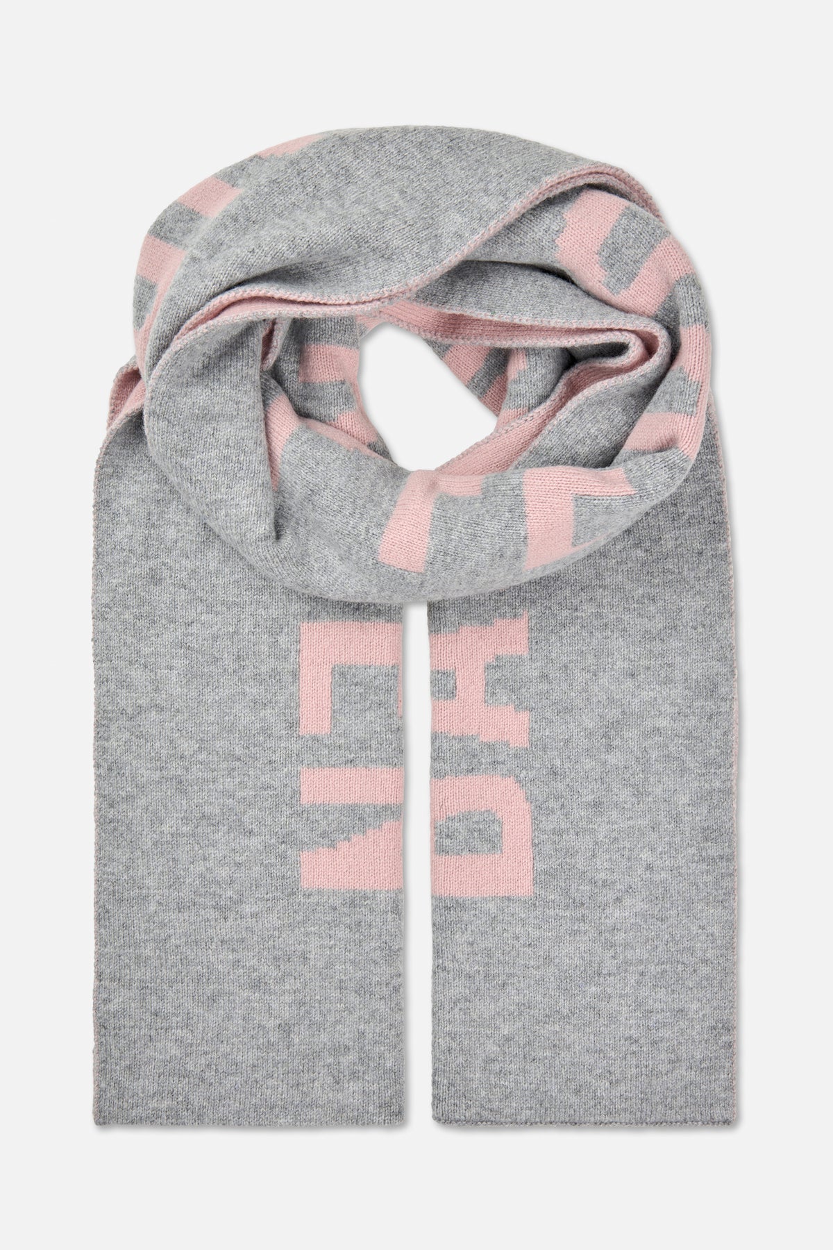 Knitted grey scarf with large pink geometric blocks, folded to show its long ends and stitched edges.