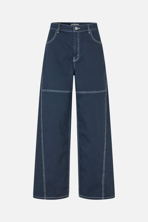 Front view of dark blue jeans with wide legs, white contrast stitching, curved front pockets and a button closure.
