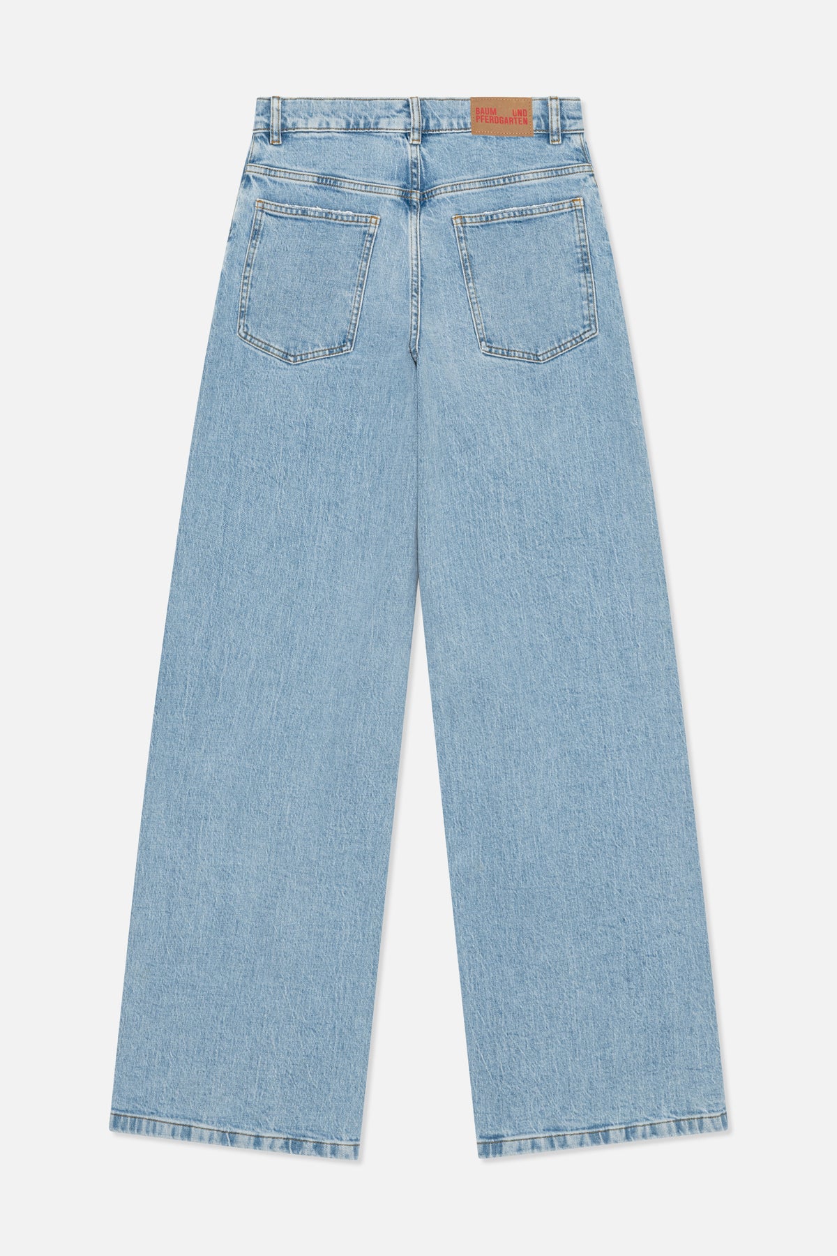 Back view of light blue wide-leg jeans with two patch pockets, belt loops and a tan waistband label.