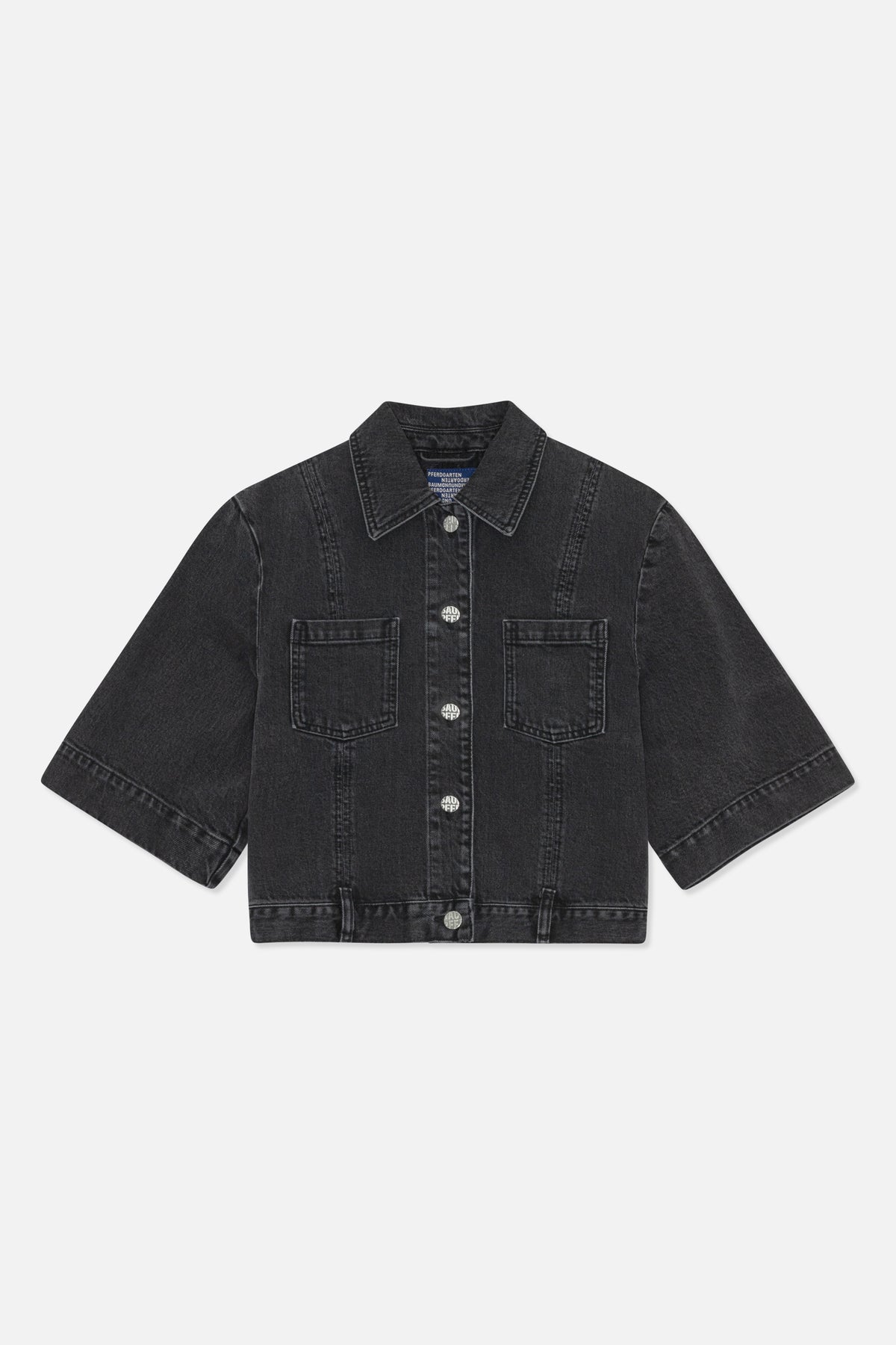 Front view of a charcoal-black denim jacket with a pointed collar, button front, two chest pockets and wide sleeves.