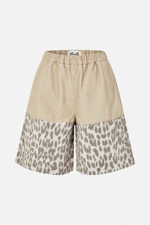 Front view of wide-leg shorts with a beige ribbed waistband and upper panels, and grey abstract animal-print lower panels.