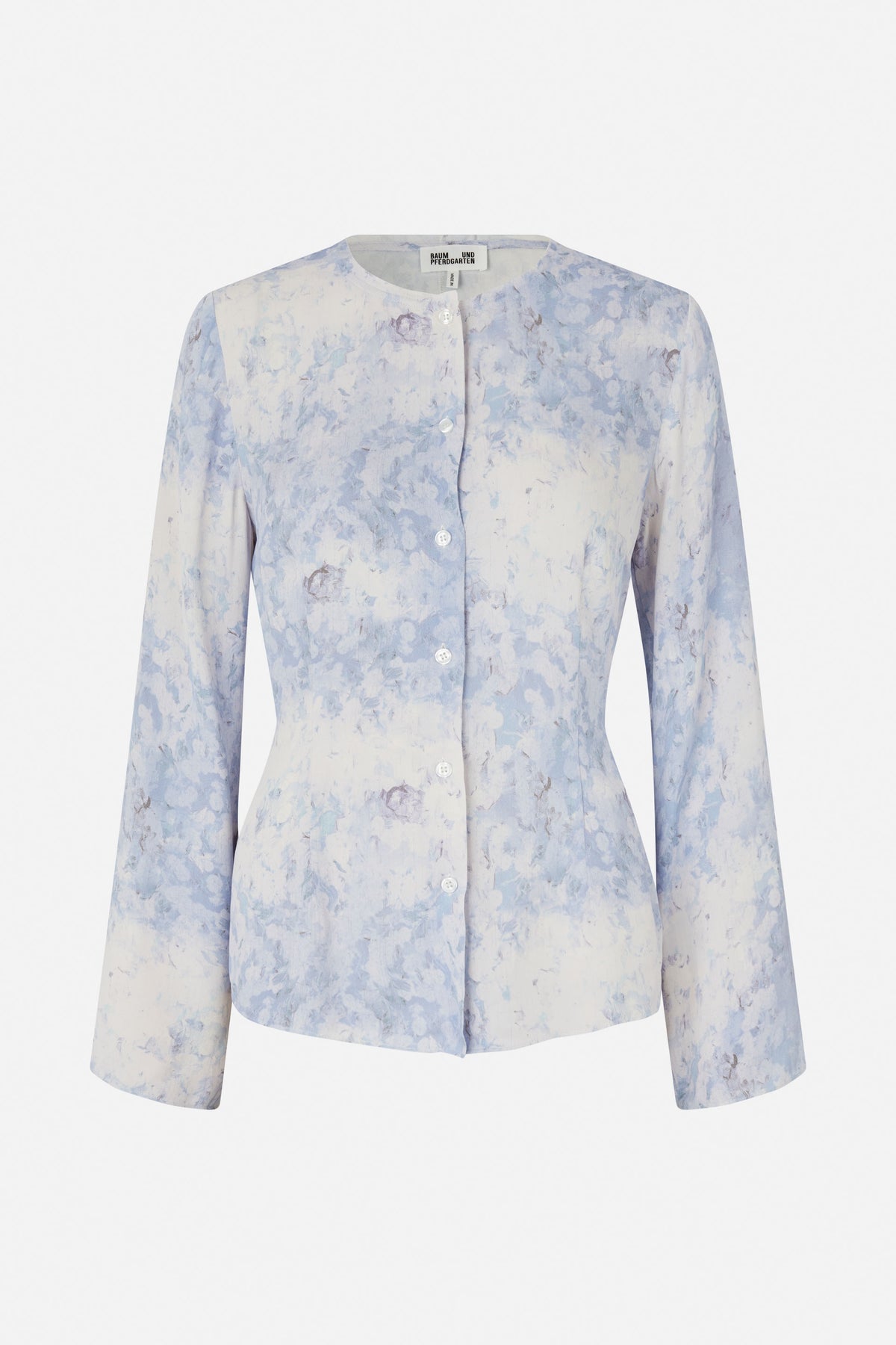 Front view of a long-sleeved button-up blouse with a round neckline and pale blue, white and muted mauve floral print.