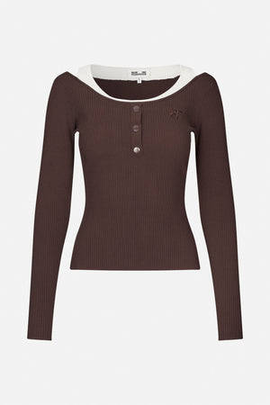 Dark brown ribbed long-sleeve top with a white layered neckline, three front snaps and small chest embroidery, shown from the front.