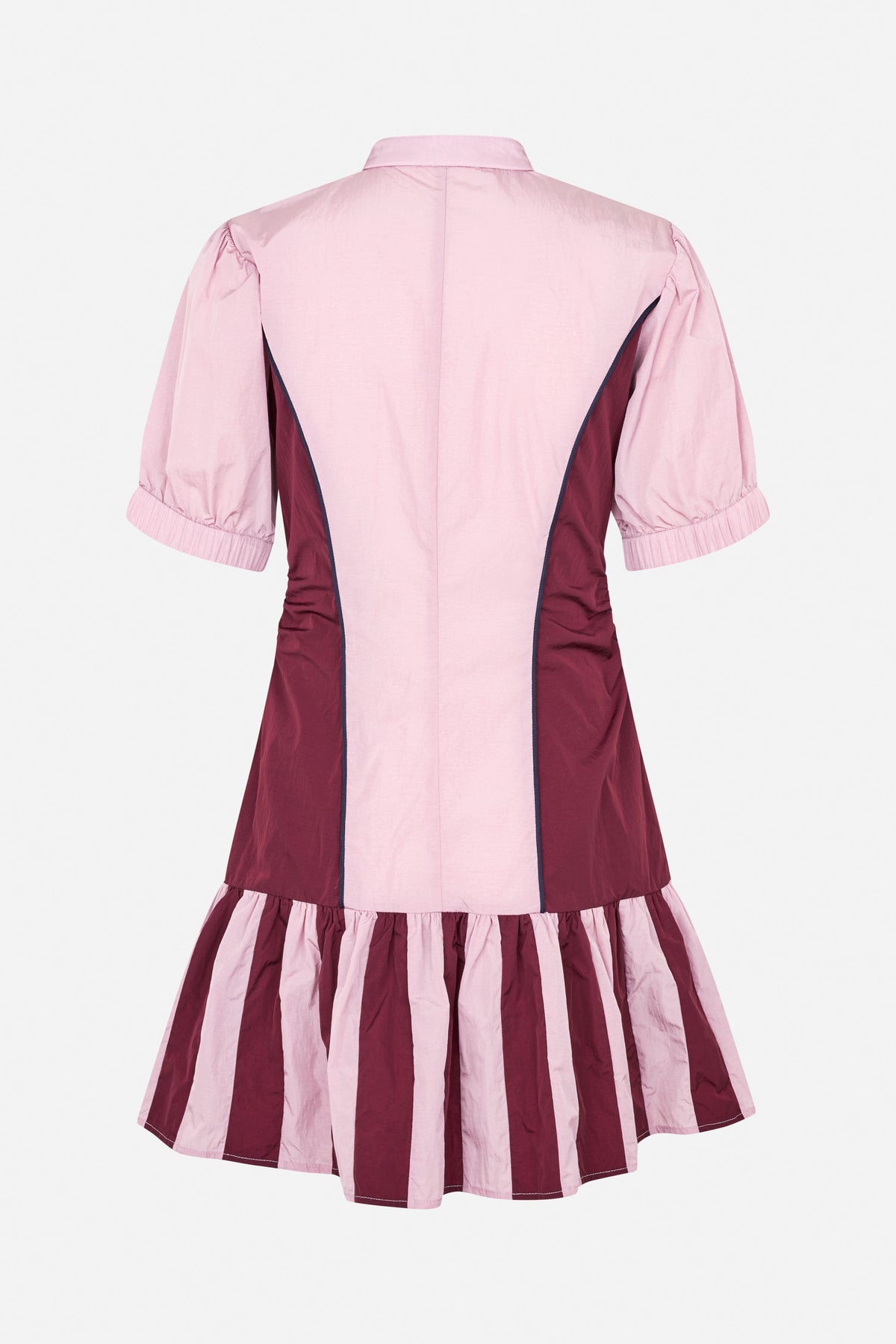 Back view of a collared short-sleeve dress in pale pink and burgundy, with contrasting panels and a gathered striped skirt.