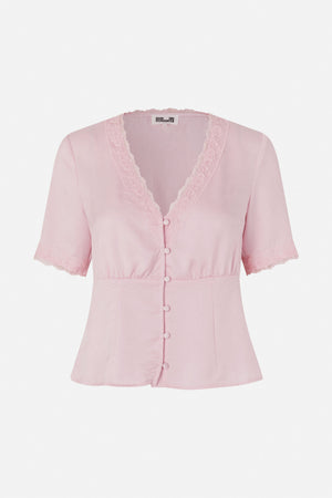 Front view of a pale pink short-sleeved blouse with a lace-trimmed V-neck, matching covered buttons and lace sleeve hems.