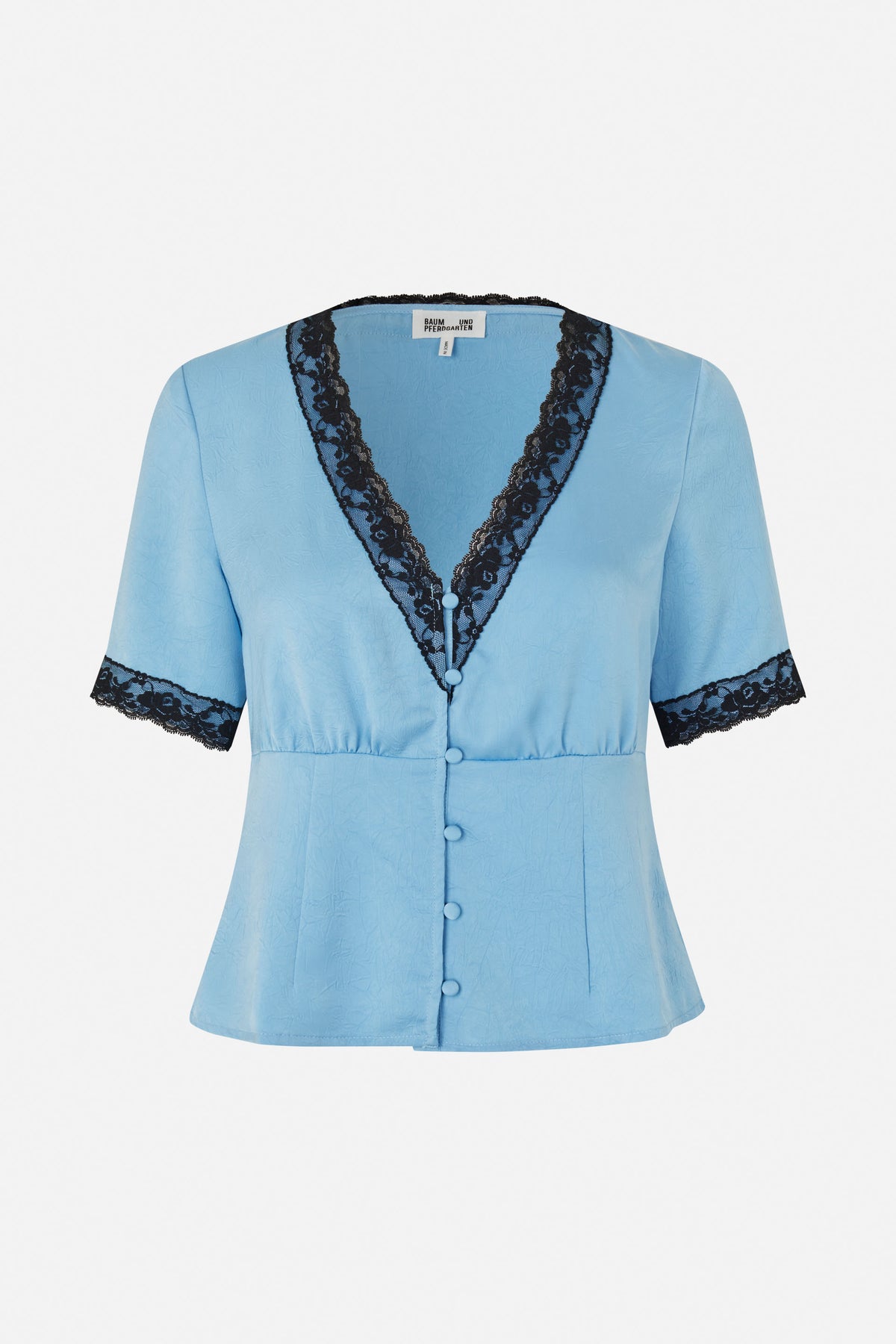 Front view of a light blue short-sleeved blouse with black lace trim, a deep V-neck and fabric-covered buttons.