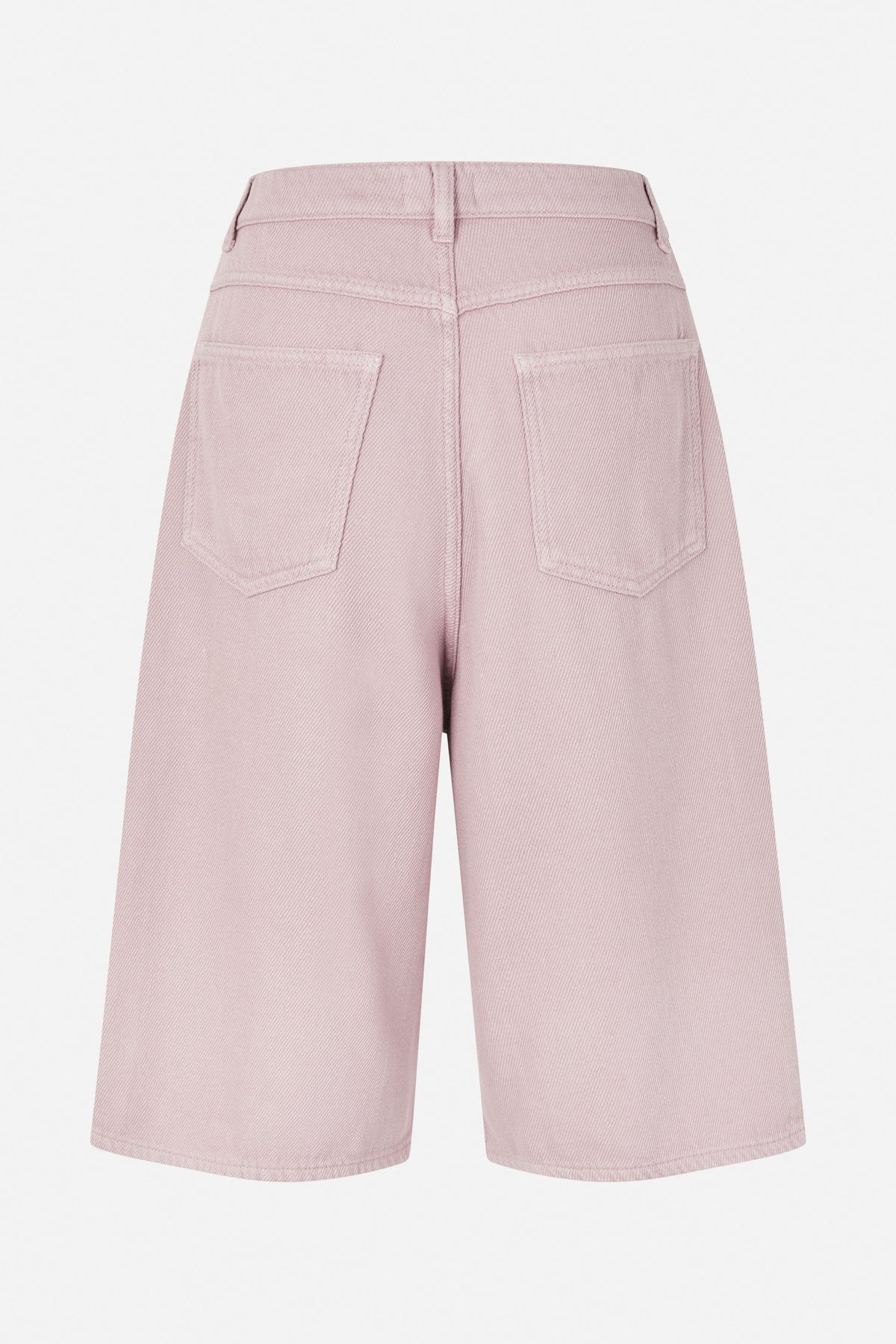 Back view of pale pink wide-leg denim shorts with belt loops, two patch pockets and knee-length hems.