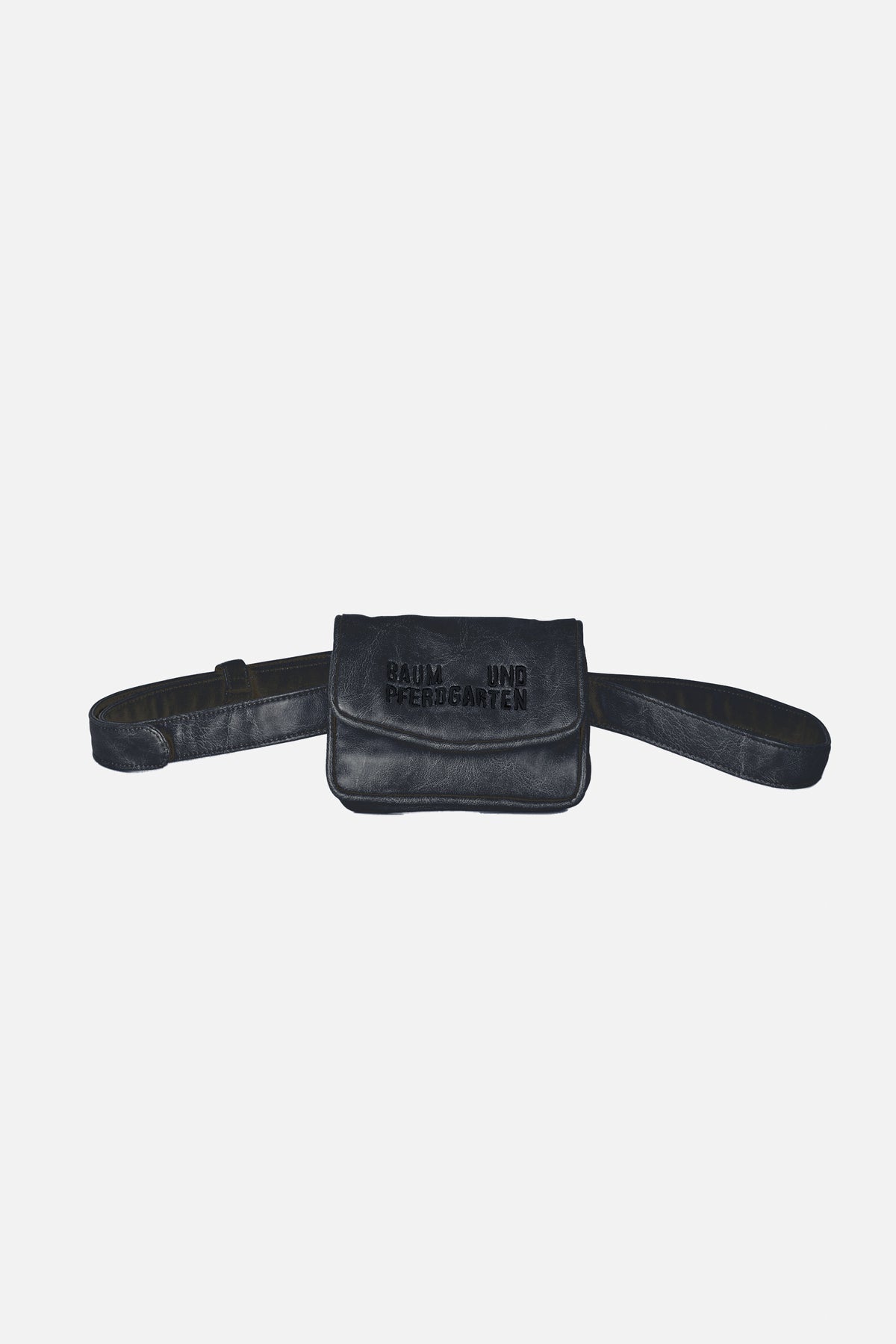 Black textured waist bag with a long belt strap and embossed lettering on the front flap, shown straight-on.