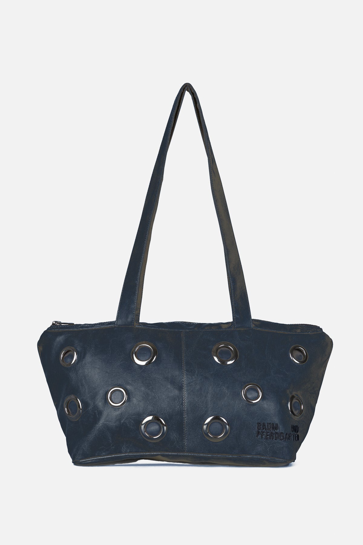 Front view of a dark navy tote bag with long shoulder straps, rows of silver metal eyelets and a Baum und Pferdgarten logo.