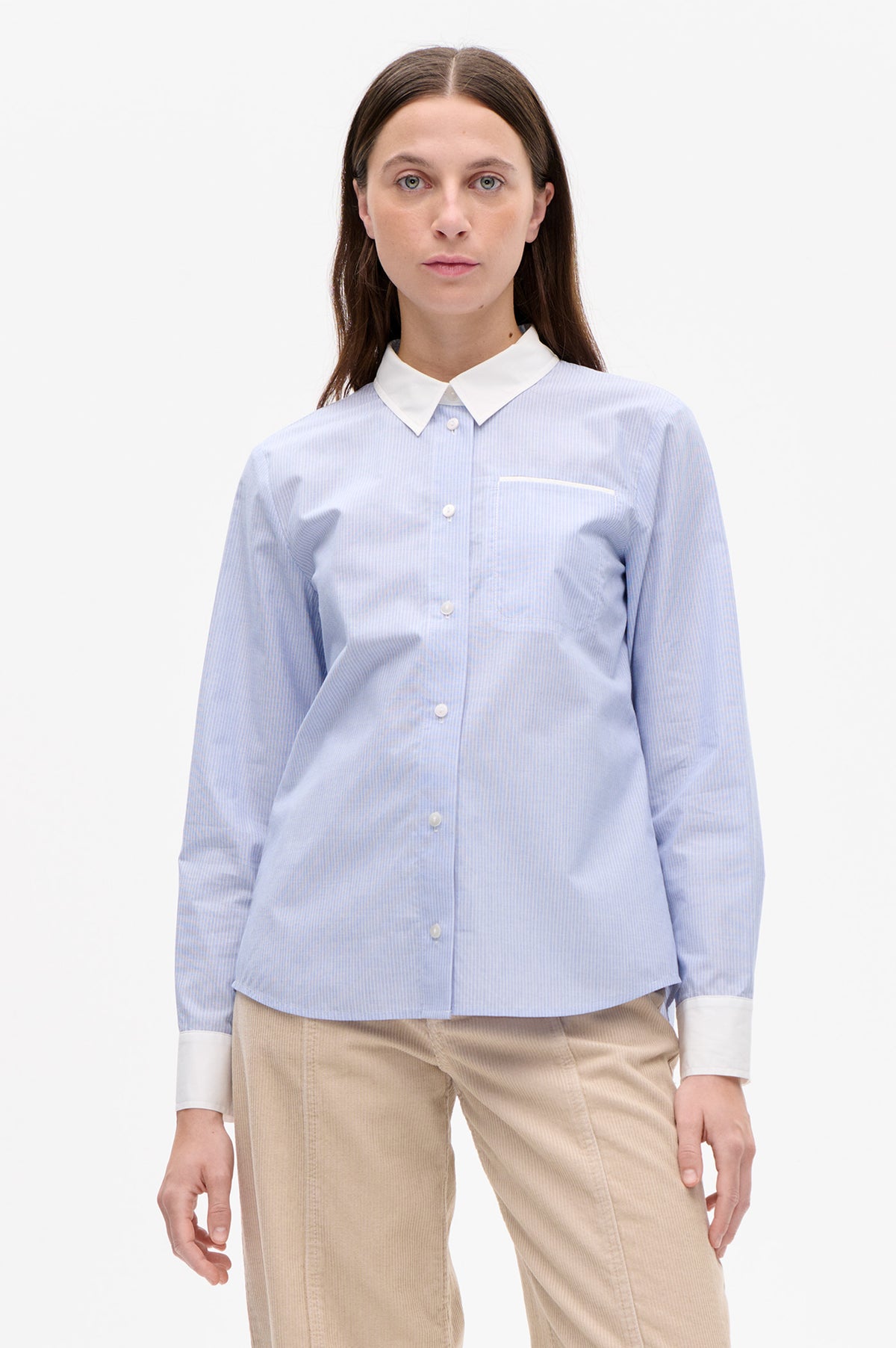 Front view of a light blue and white pinstripe button-up shirt with a contrasting white collar, cuffs and chest pocket.