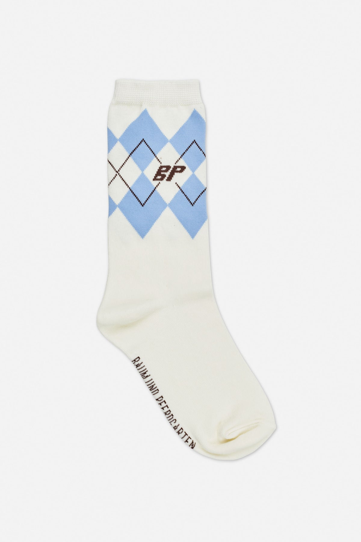 Cream crew socks with light blue argyle diamonds, brown line accents and a small brown monogram, shown at an angle.