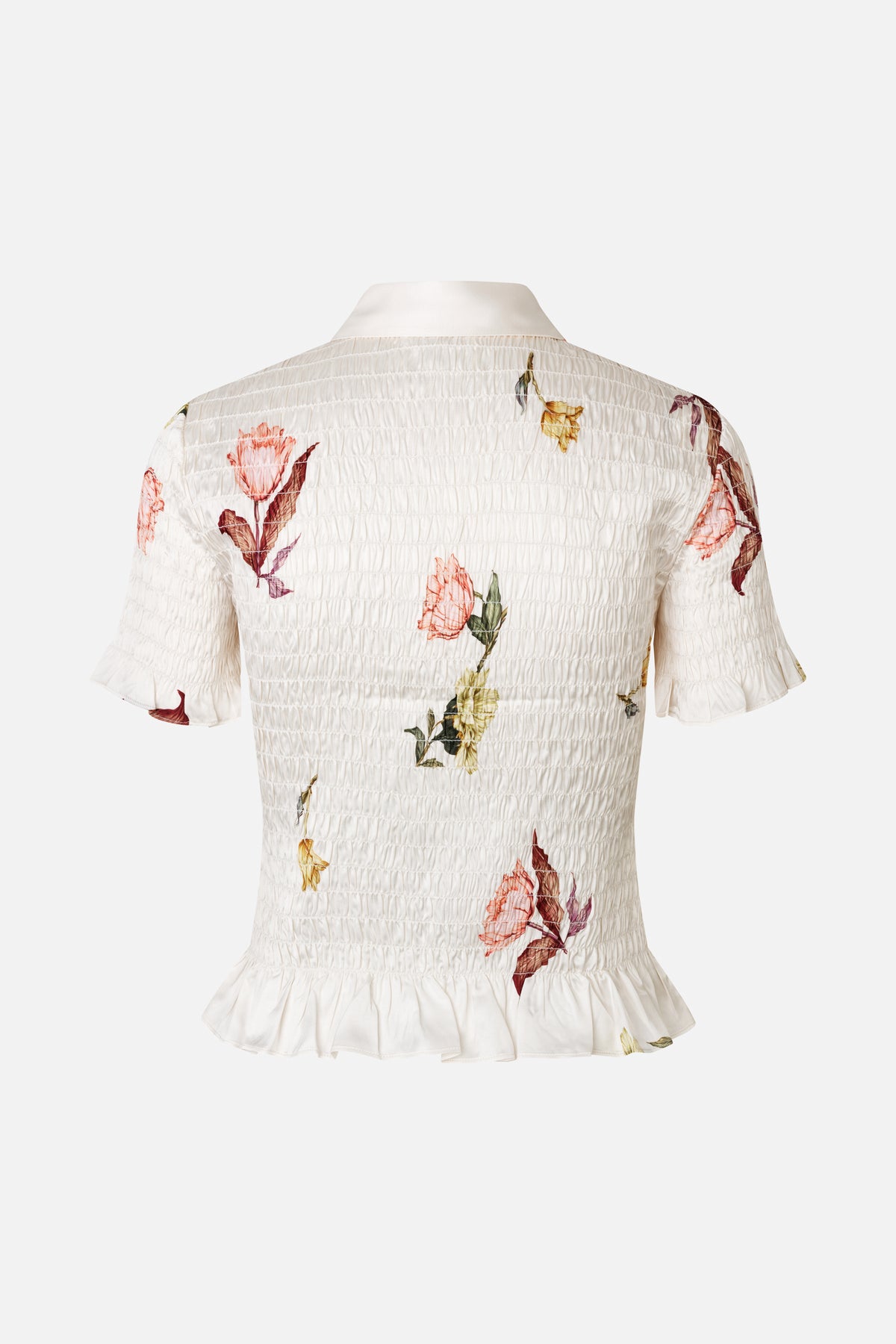 Back view of an ivory floral-print blouse with a pointed collar, smocked body, and ruffled short sleeves and hem