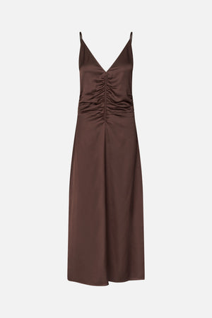 Front view of a chocolate brown slip dress with thin straps, a deep V-neck and ruched detailing down the bodice.