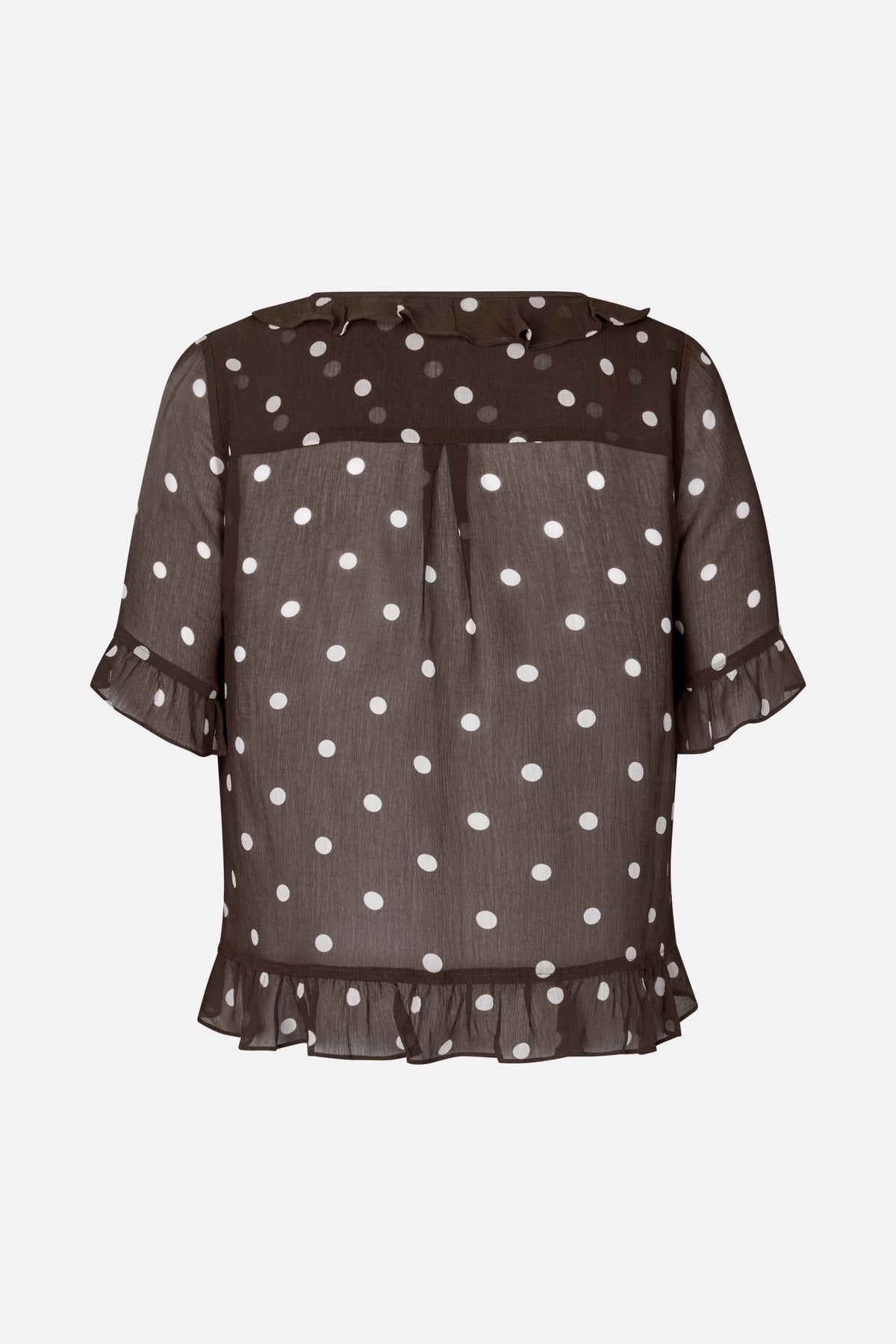 Front view of a sheer dark brown blouse with white polka dots, a ruffled neckline, flared sleeves and a gathered hem.