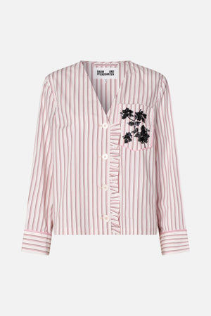 Front view of a cropped white shirt with pink and burgundy stripes, button front, ruffled placket and black sequin floral chest pocket.