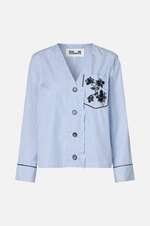 Front view of a cropped light-blue and white striped shirt with black floral sequin detail on the chest pocket and wide striped cuffs.