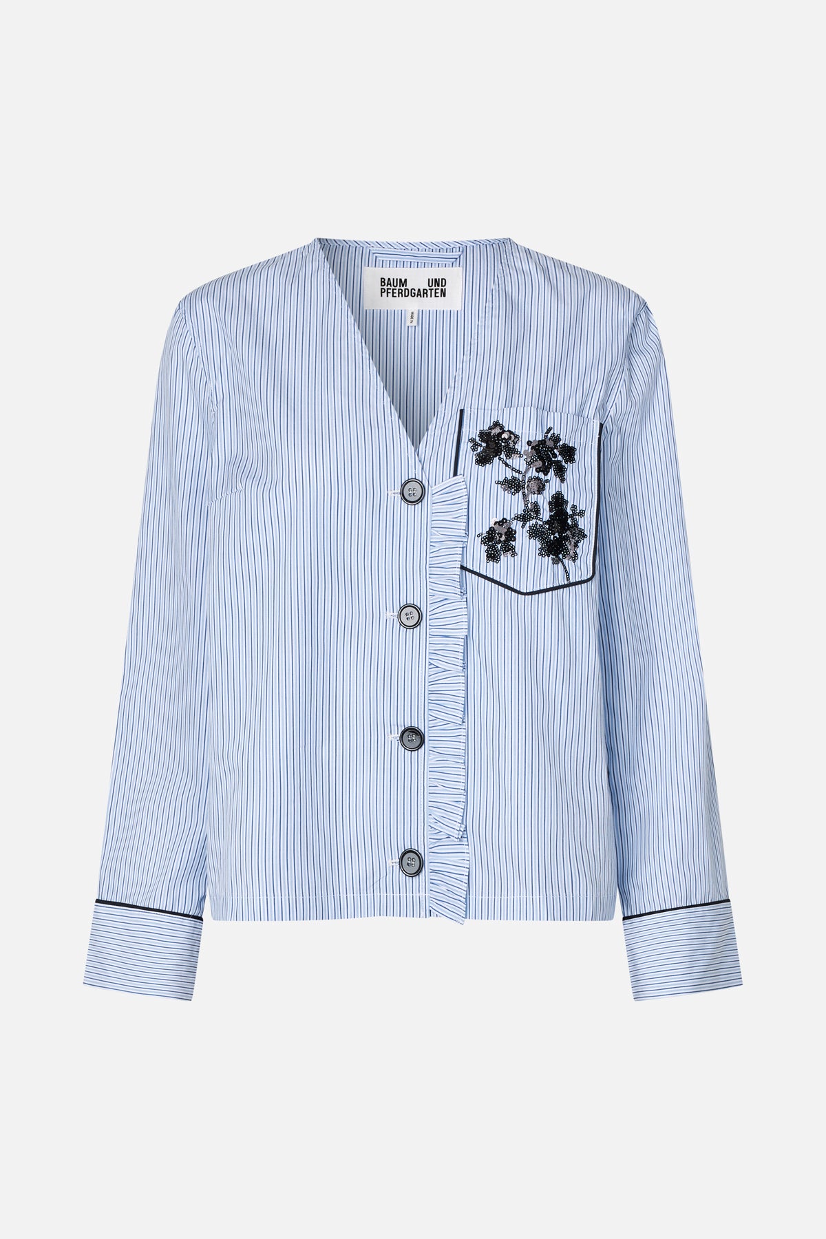 Front view of a cropped light-blue and white striped shirt with black floral sequin detail on the chest pocket and wide striped cuffs.