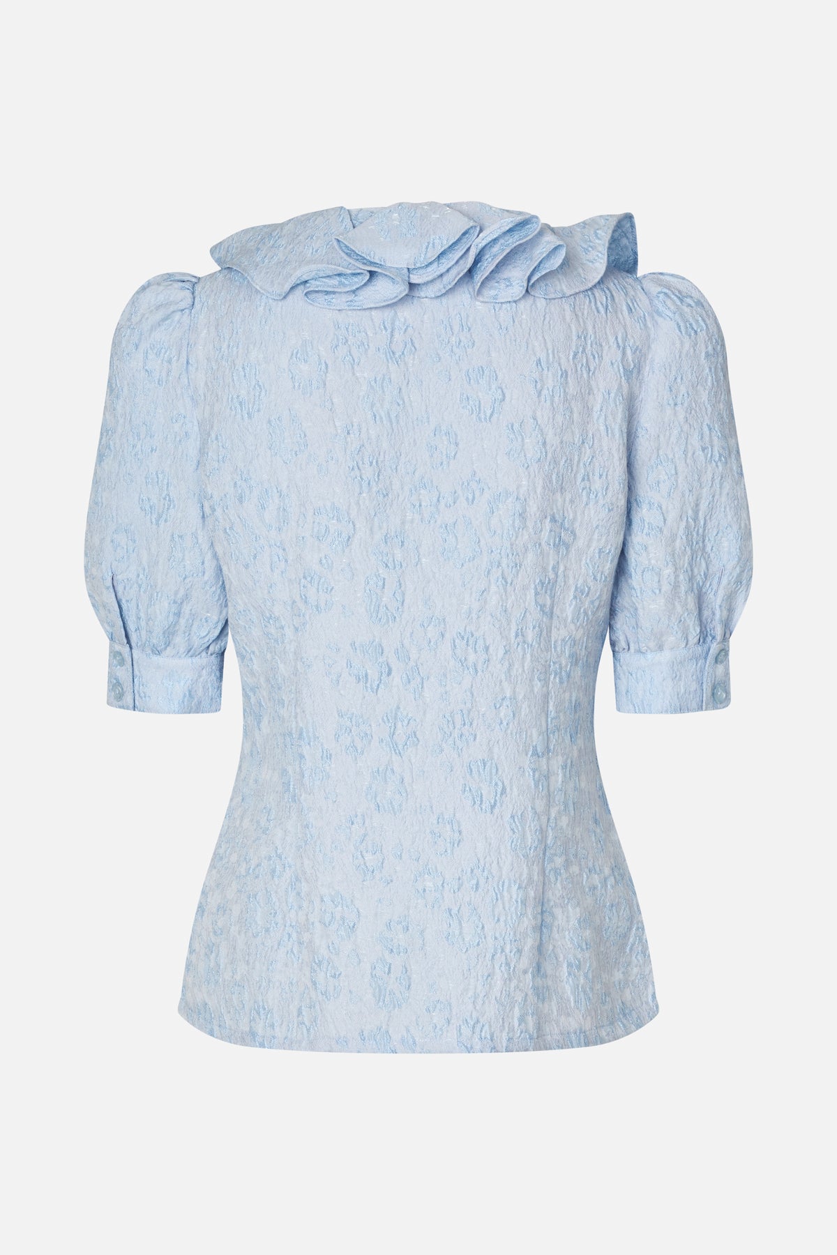 Front view of a pale blue jacquard dress with a ruffled neckline, puff sleeves and buttoned cuffs