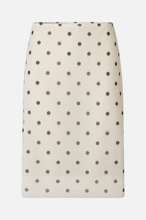 Front view of a cream A-line skirt with evenly spaced dark brown polka dots.