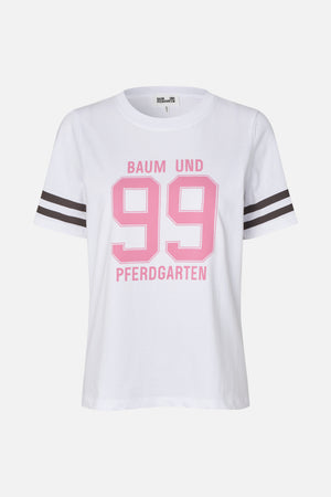 White crew-neck T-shirt with a large pink “99” and Baum und Pferdgarten lettering, plus dark double stripes on the sleeves.