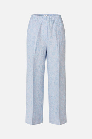 Front view of light blue wide-leg trousers with an elasticated waistband and subtle tonal floral pattern.
