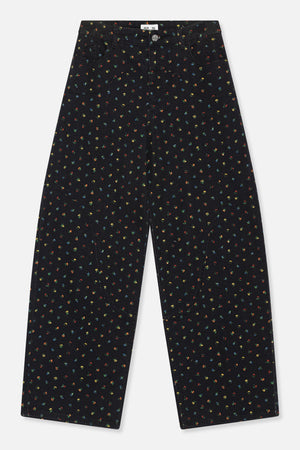 Front view of black wide-leg jeans with tiny multicoloured floral print, belt loops, a button closure and curved pockets.
