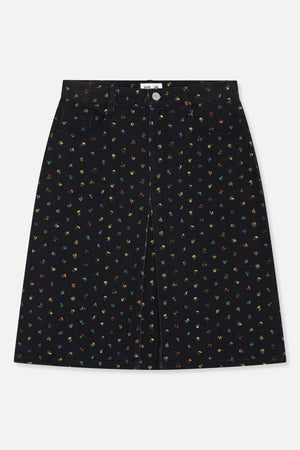 Front view of a black A-line skirt with tiny multicoloured floral motifs, a buttoned waistband and front pockets.