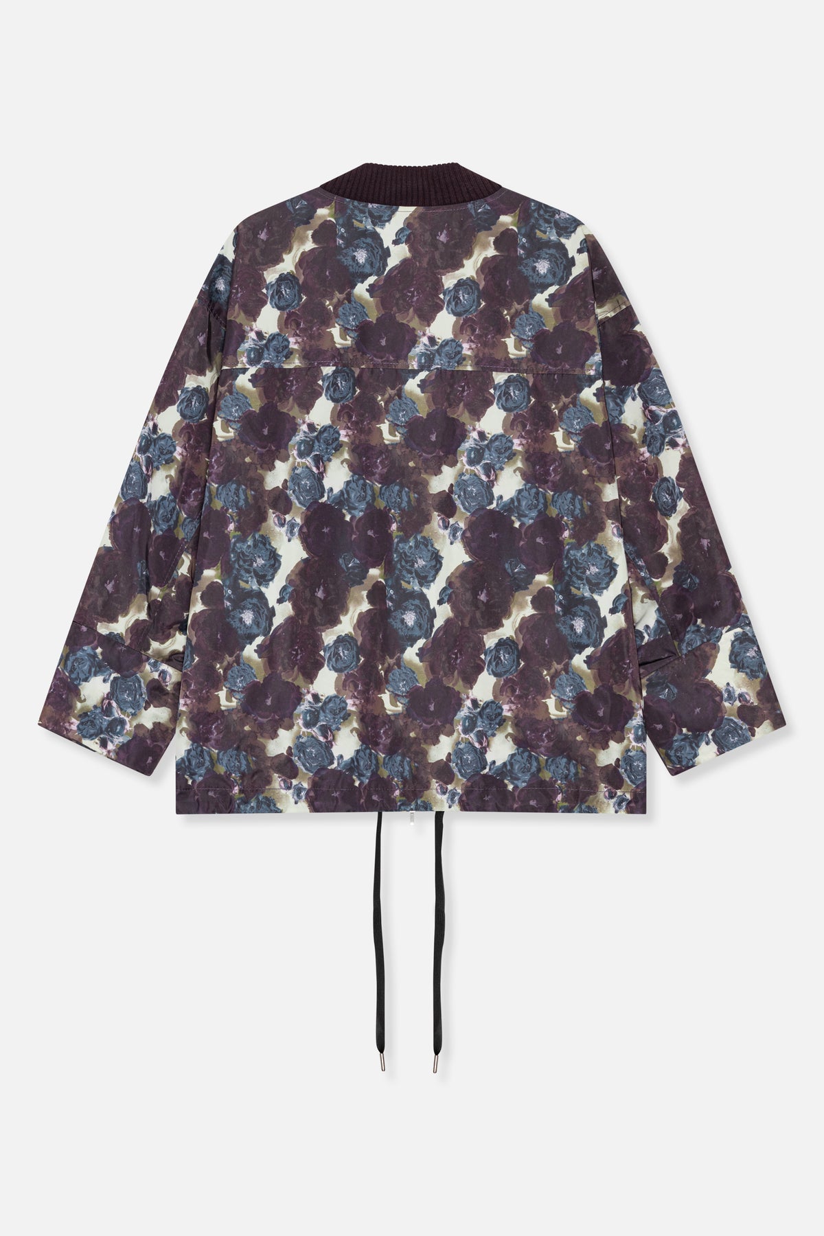 Back view of a floral-print jacket with a dark ribbed collar and drawcord hem, featuring burgundy and blue flowers on a cream background.
