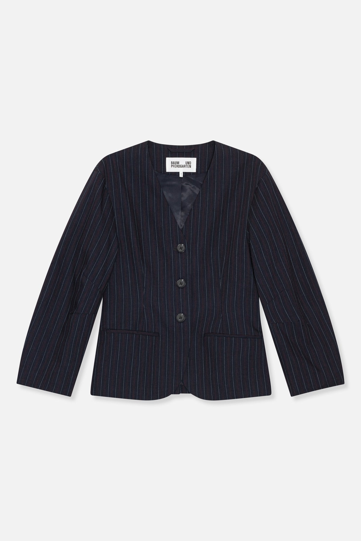 Front view of a dark navy pinstriped blazer with a collarless neckline, three buttons and two welt pockets.