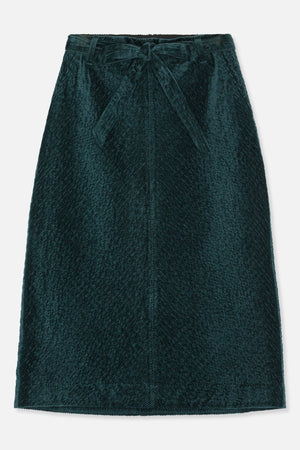 Front view of a dark teal corduroy skirt with a matching self-tie belt and diagonal ribbed texture.