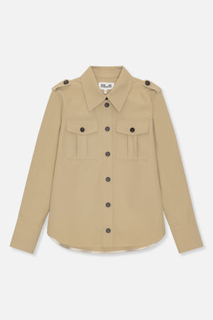 Front view of a beige long-sleeved button-up shirt with a pointed collar, shoulder tabs and two buttoned chest pockets.