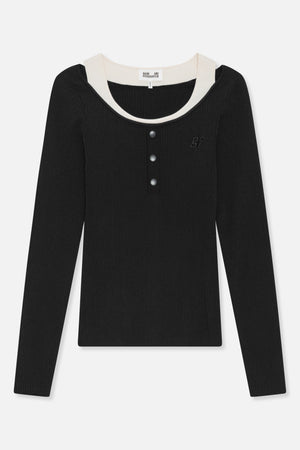 Front view of a black ribbed long-sleeve top with a cream contrast neckline, three front buttons and a small chest emblem.