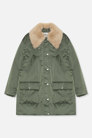 Front view of a long olive green coat with a plush beige collar, snap-button front and four large pockets.