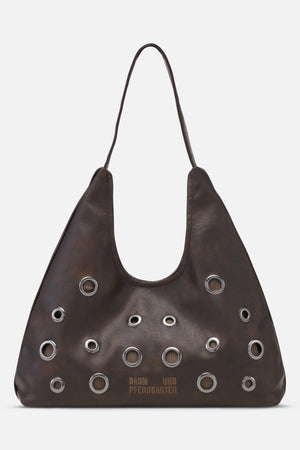 Front view of a dark brown shoulder bag with a long strap, scattered silver eyelets, and Baum und Pferdgarten logo.