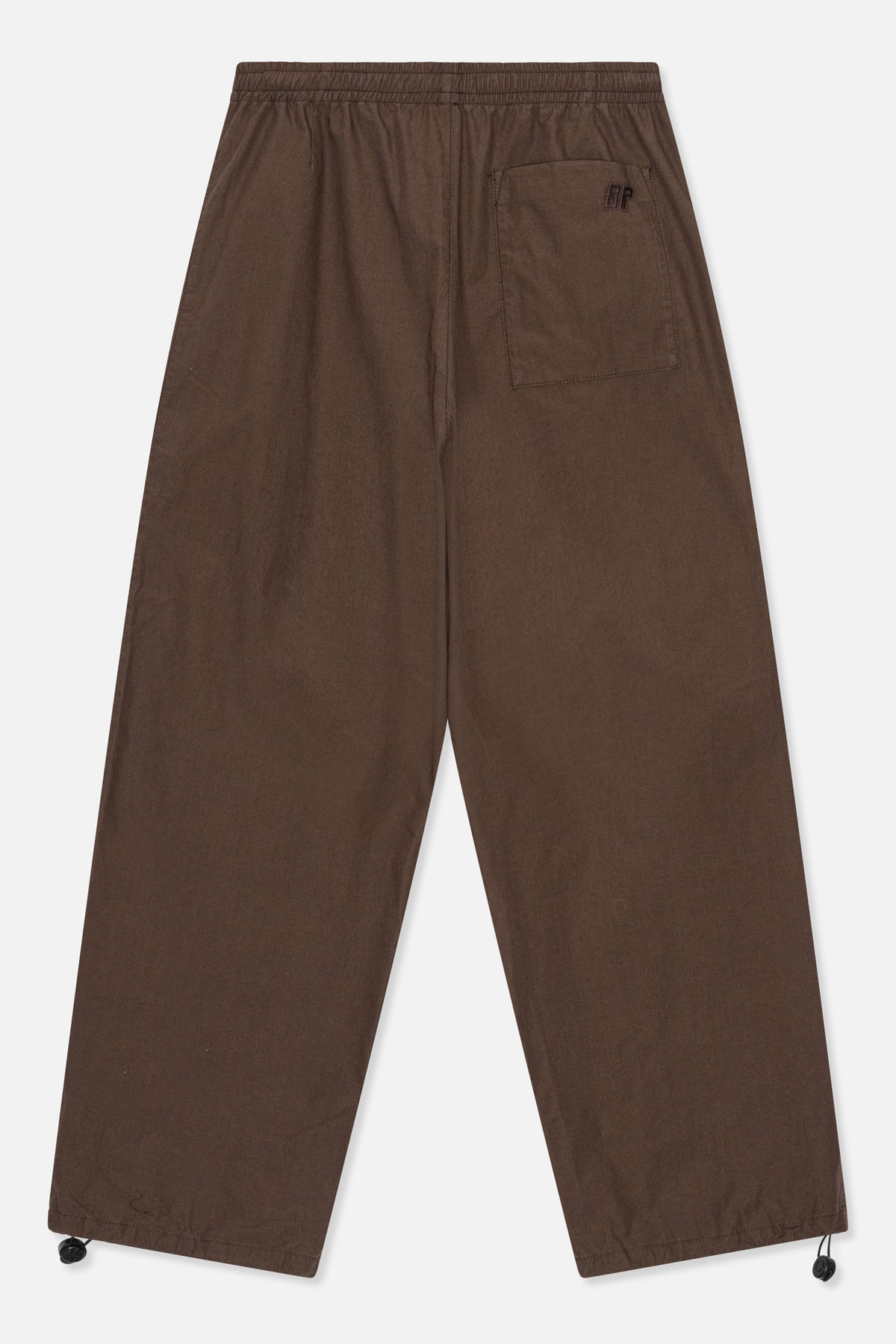 Back view of dark brown wide-leg trousers with an elastic waistband, a patch pocket, and adjustable drawstring hems.