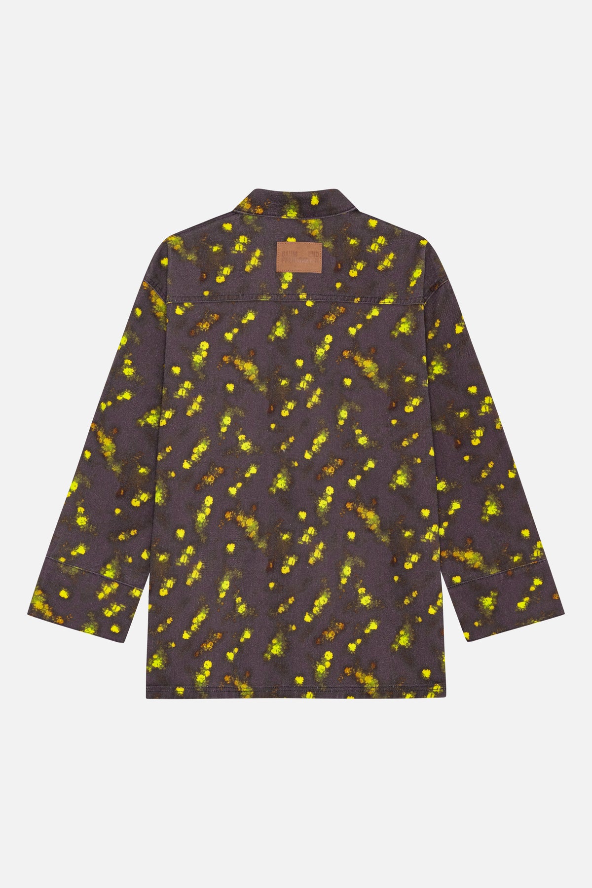 Back view of a dark charcoal jacket with a pointed collar, scattered yellow and green floral pattern, and a brown logo patch.