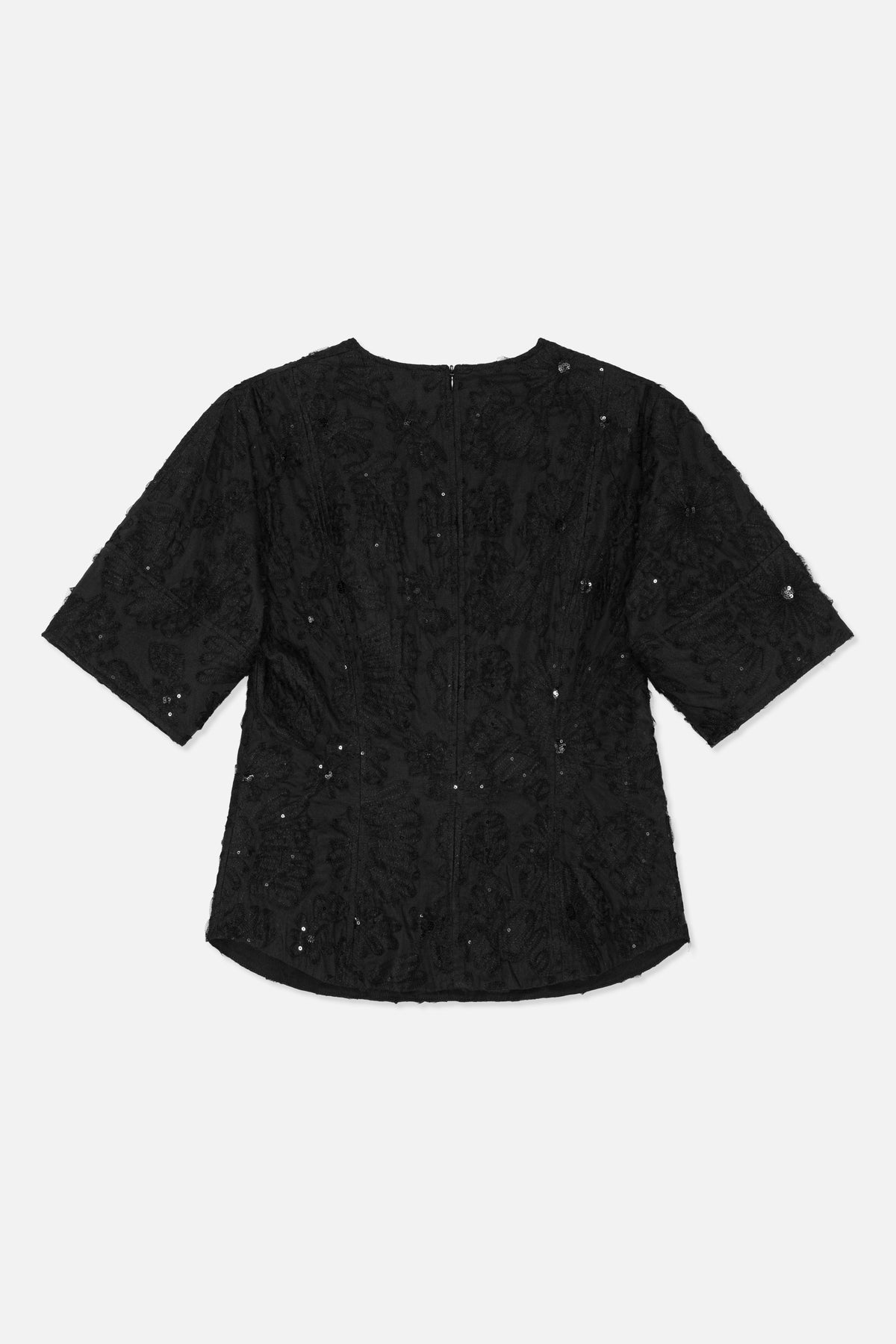 Back view of a black short-sleeved dress with a tonal floral pattern, scattered sequins and a centre-back zip.