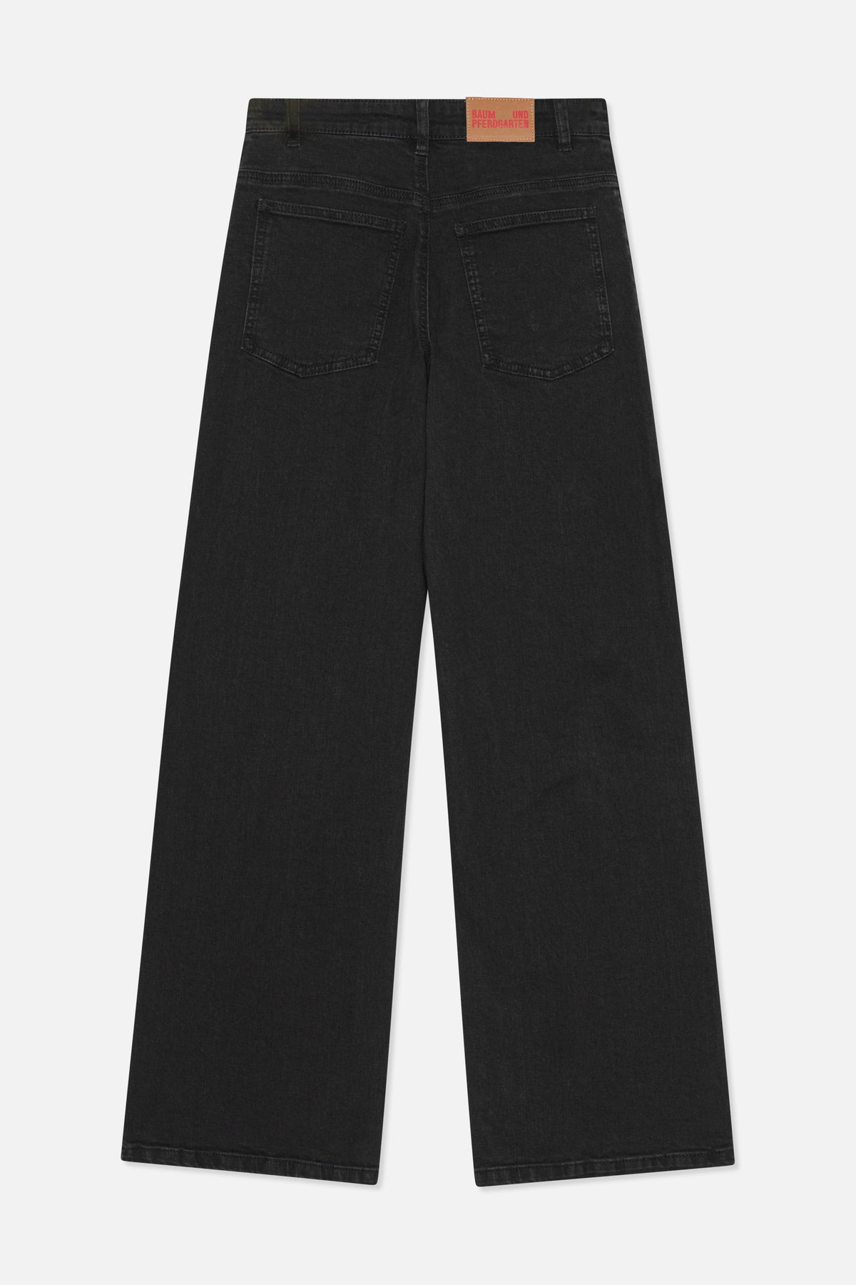 Back view of charcoal-black wide-leg jeans with two patch pockets, belt loops and a tan branded waistband patch.
