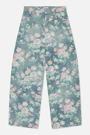 Front view of wide-leg blue denim jeans with an all-over pastel pink, yellow and mint floral print.