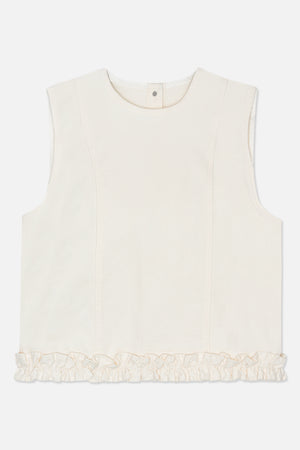 Front detail of an ivory sleeveless top with a rounded neckline, panel seams, a back-neck snap and a gathered ruffle hem.
