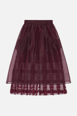 Burgundy A-line skirt with an elastic waistband, sheer overlay, side pockets and floral detailing along the hem.