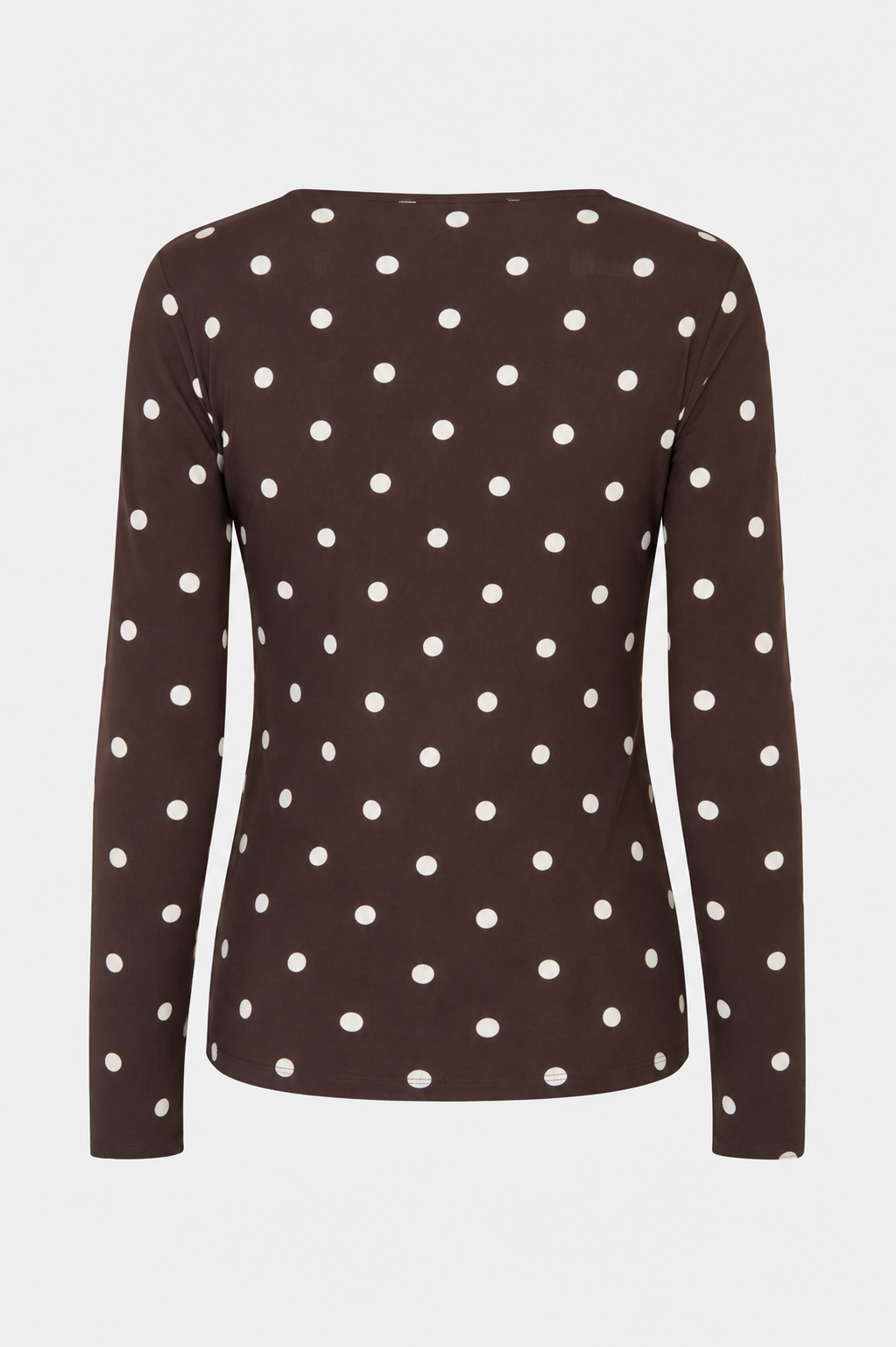 Back view of a dark brown long-sleeved top with evenly spaced white polka dots
